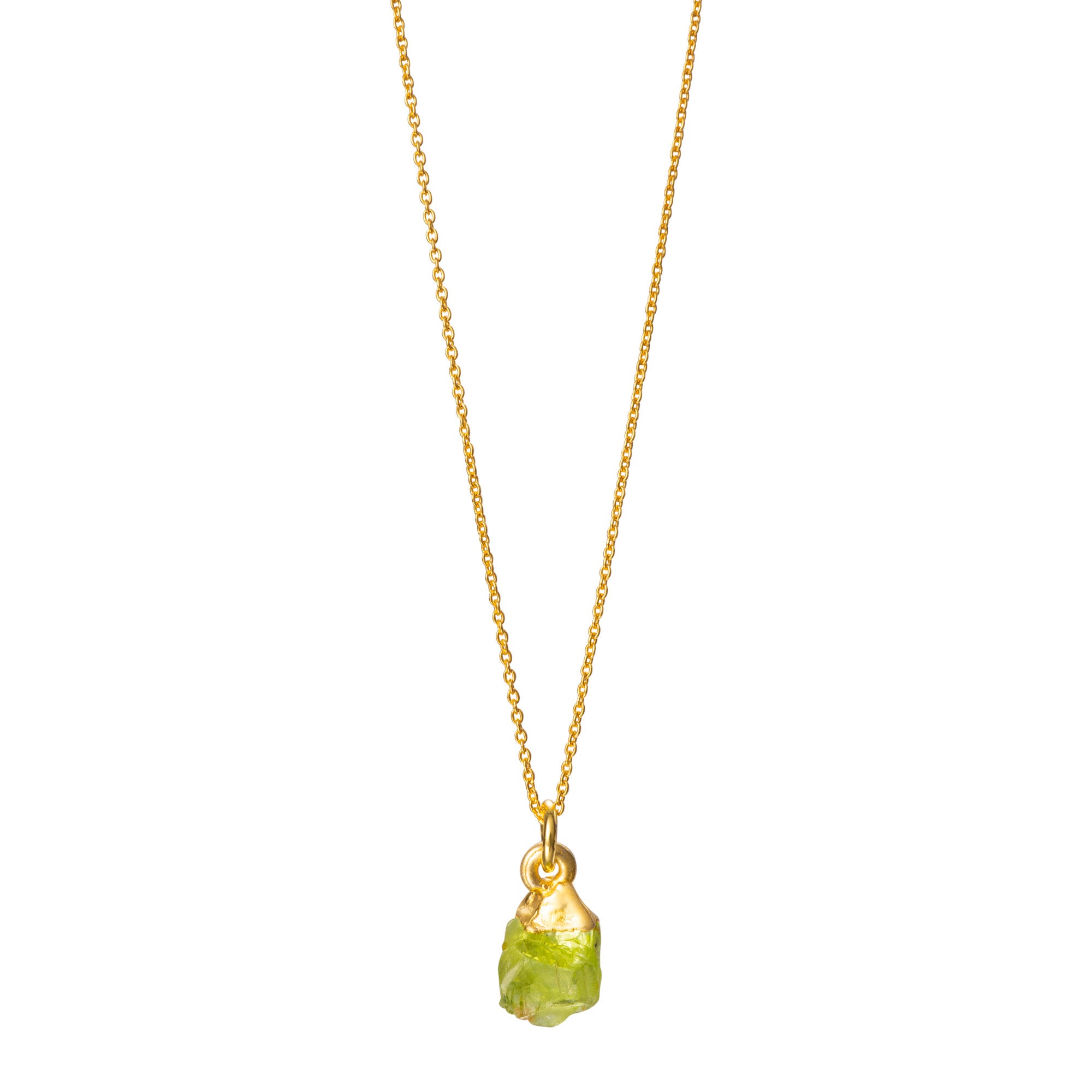 A raw crystal Peridot pendant necklace on a gold chain, with the pendant displaying a bright green color.