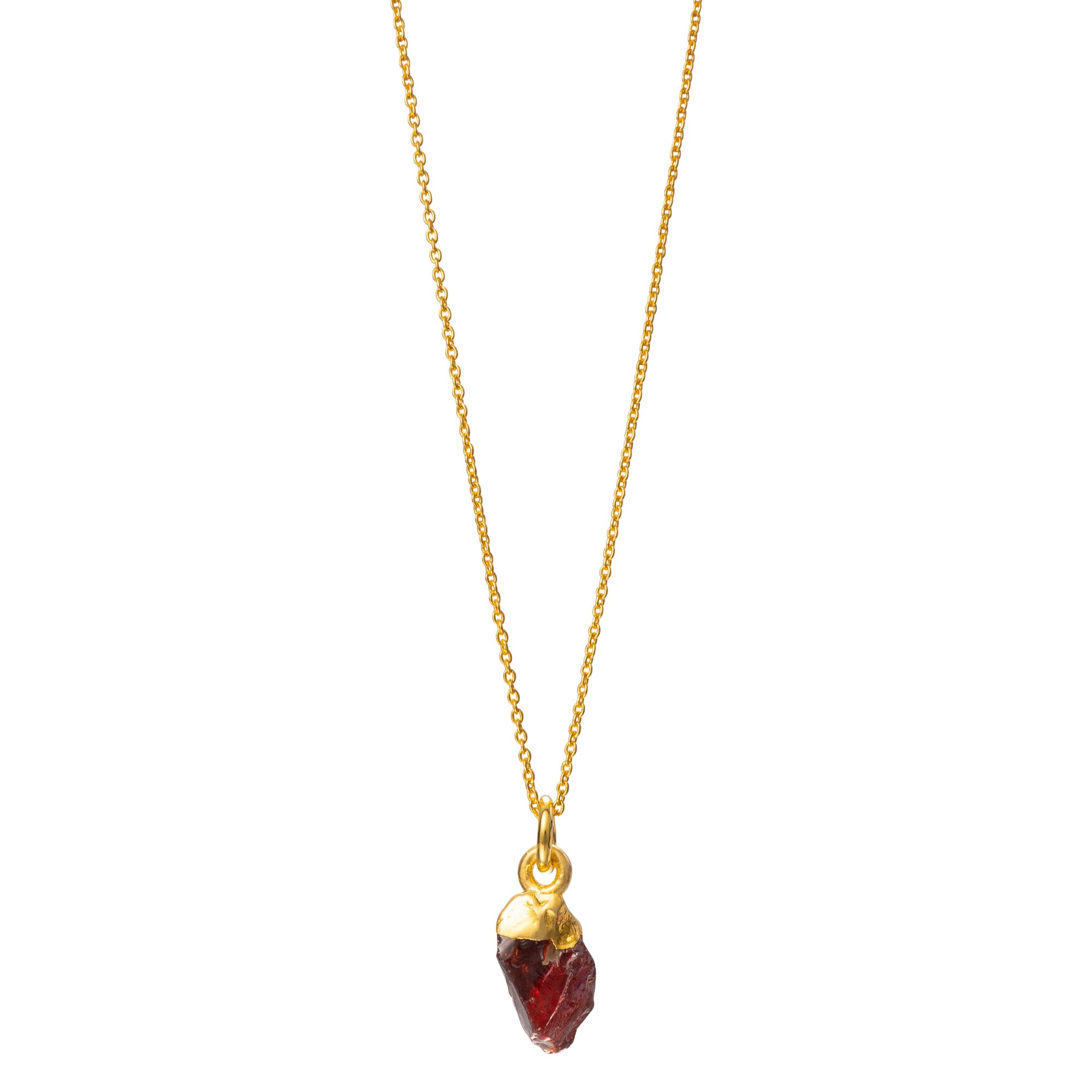 A raw crystal garnet pendant attached to a gold-filled chain against a white background