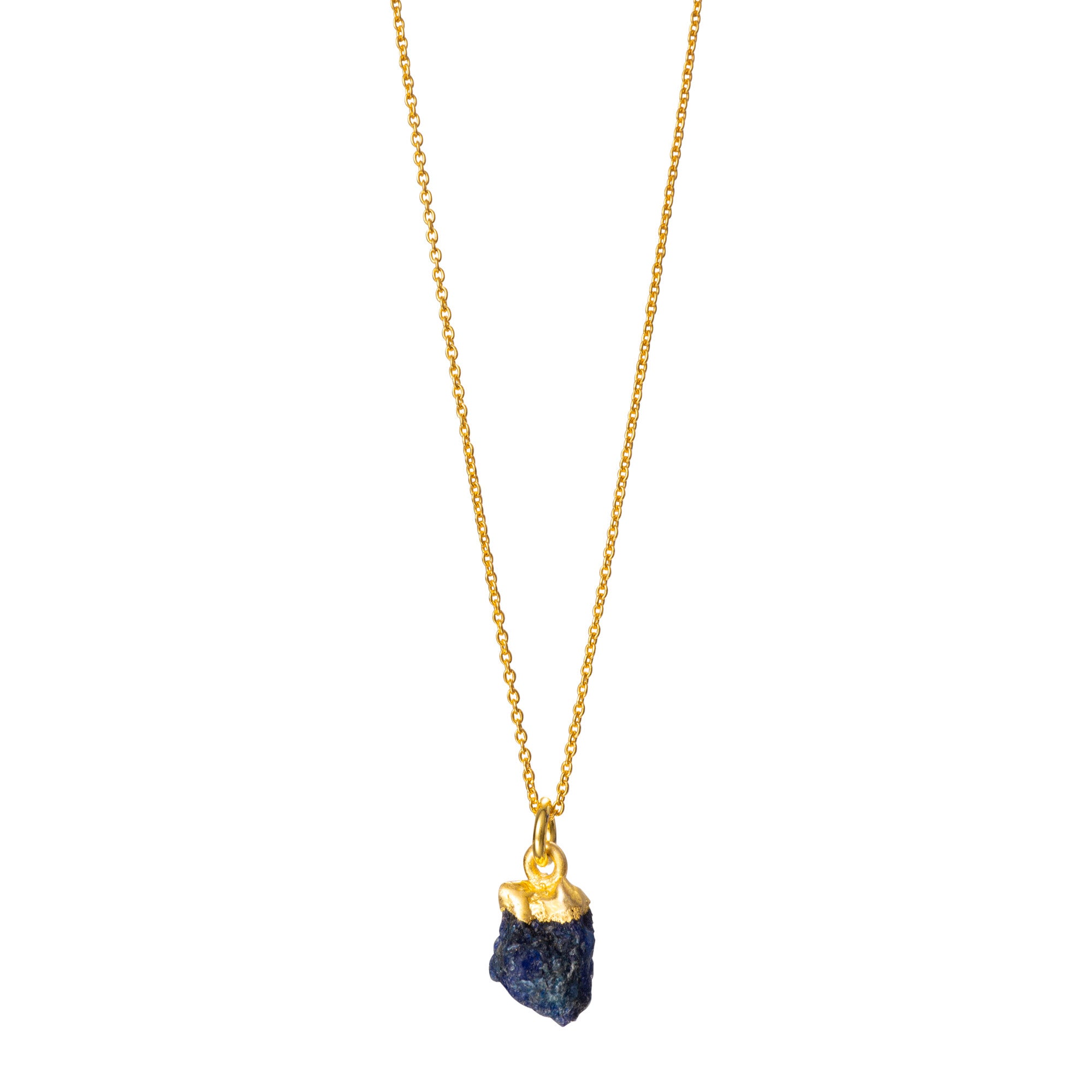 A raw Sapphire pendant electroplated in gold, hanging from a gold cable chain.