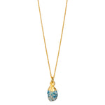 A raw Turquoise crystal pendant electroplated in gold, hanging from a gold-filled cable chain necklace.