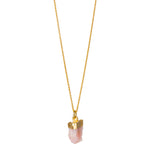 A raw peach moonstone pendant electroplated in gold, suspended from a gold-filled cable chain.